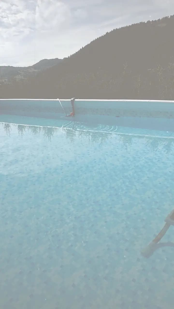 Reel frame: a pool with a mountain view